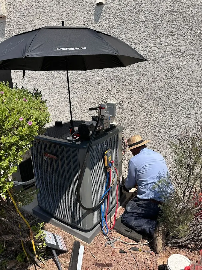 HVAC technician performing outdoor AC maintenance in Sonoma